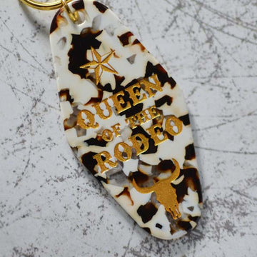 Queen Of The Rodeo Cow Print Motel Style Keychain Angled View